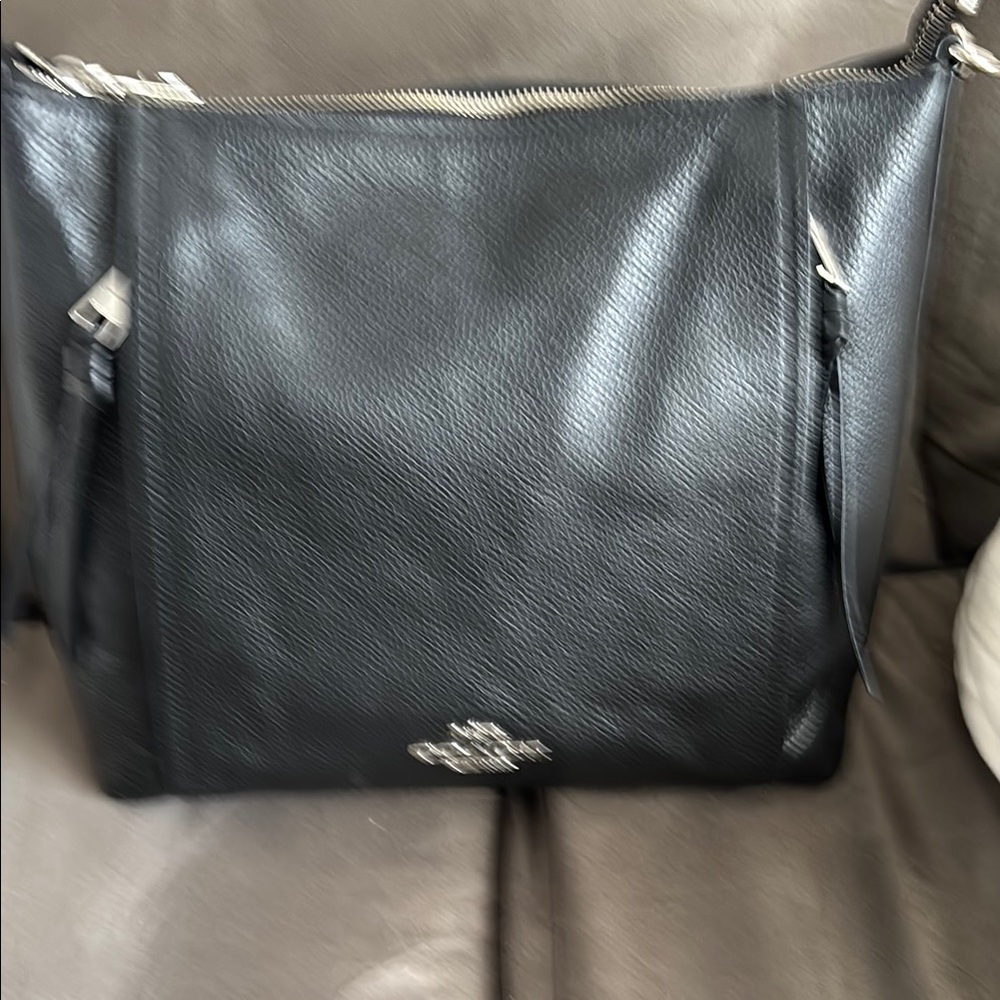 Coach Black Messenger Bag with Silver Accents and Leather Material